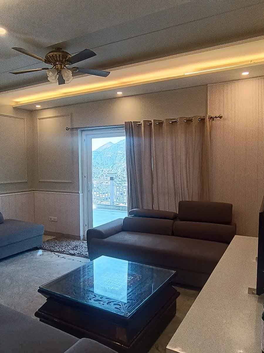 Living room with mountain view through balcony doors